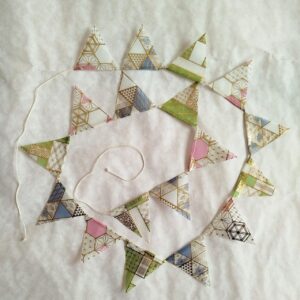 Full view of Japanese paper flag garland hanging, approx. 186 cm total length