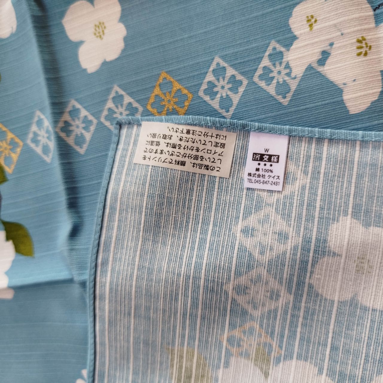 furoshiki with white flowers gold accent cotton cloth